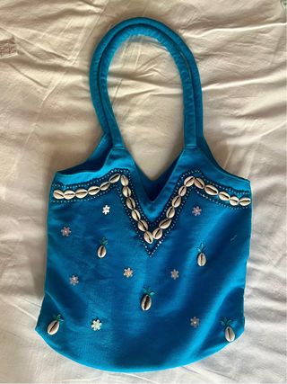 Bolso azul conchas y flores