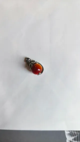 Pendente delfino con pietra arancione