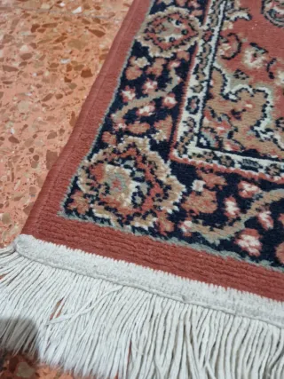 Alfombra persa pequeña