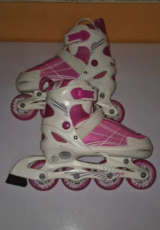 Patines en línea rosas y blancos para niña
