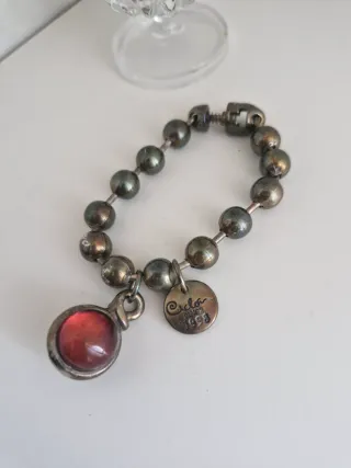 Pulsera Ciclon 1998 Plata y Piedra Roja