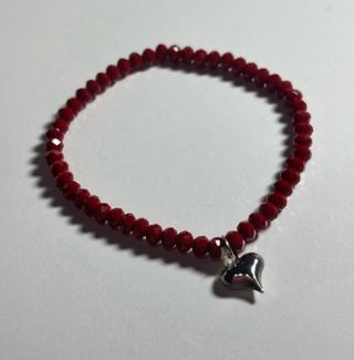 Bracciale pietre rosse con pochette