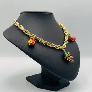 Collana con perle a forma di uva e ciliegia in oro 18K.