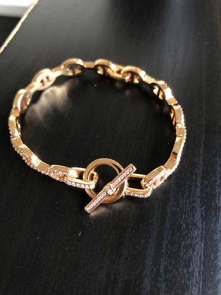 Pulsera Hermes dorada con eslabones y cierre T