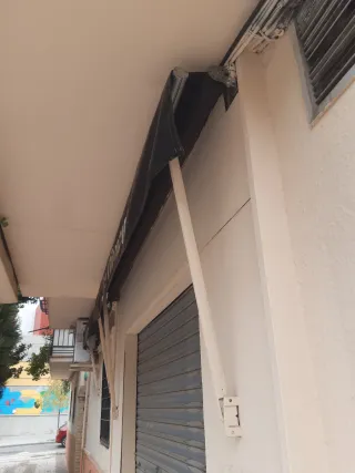 Toldo enrollable negros