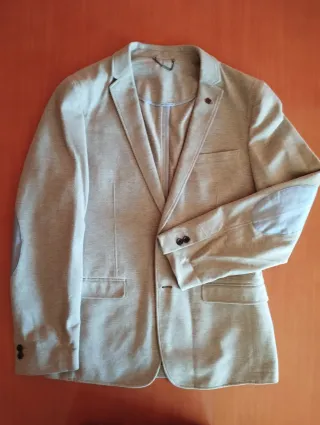 Americana gris clarito sin forro y coderas en azul