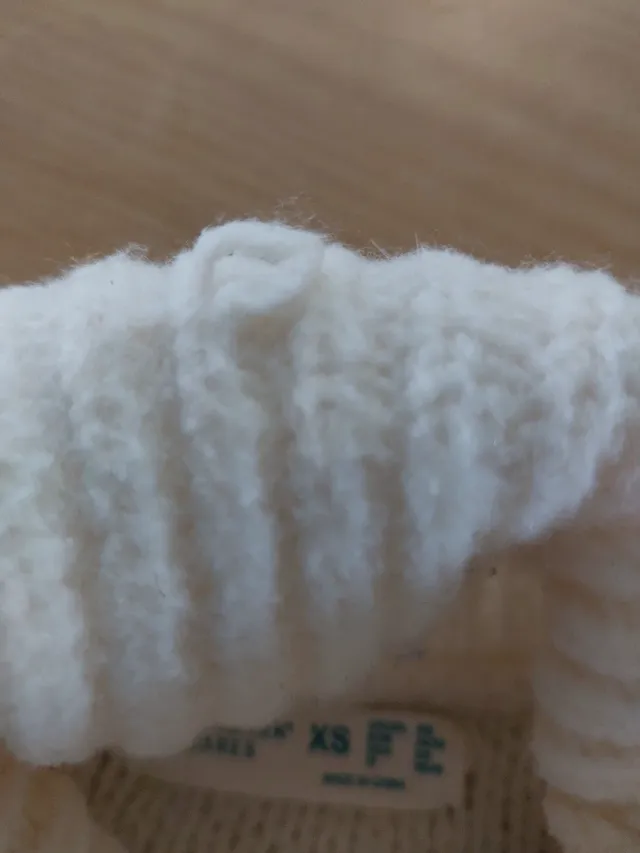 Jersey de punto blanco cuello alto