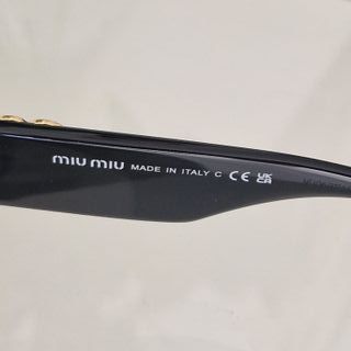 Gafas de sol Miu Miu mujer negras y doradas