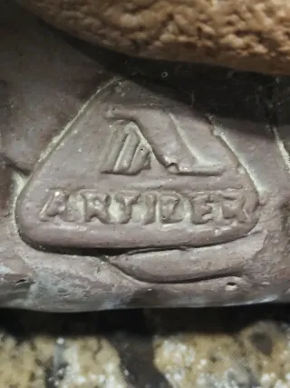 Figura de piedra para maceta