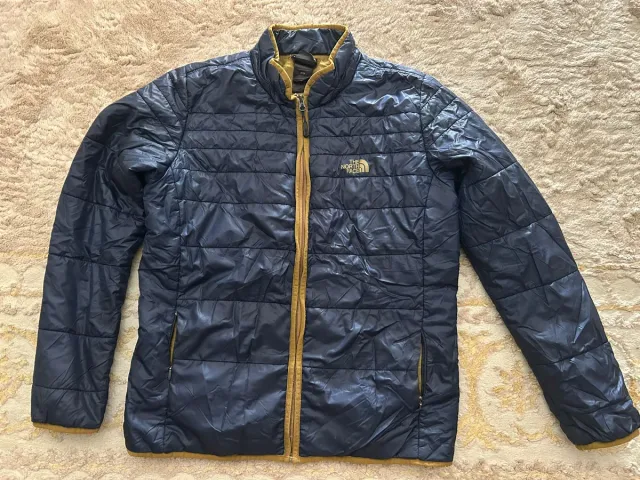 Chaqueta The North Face Azul y Dorado