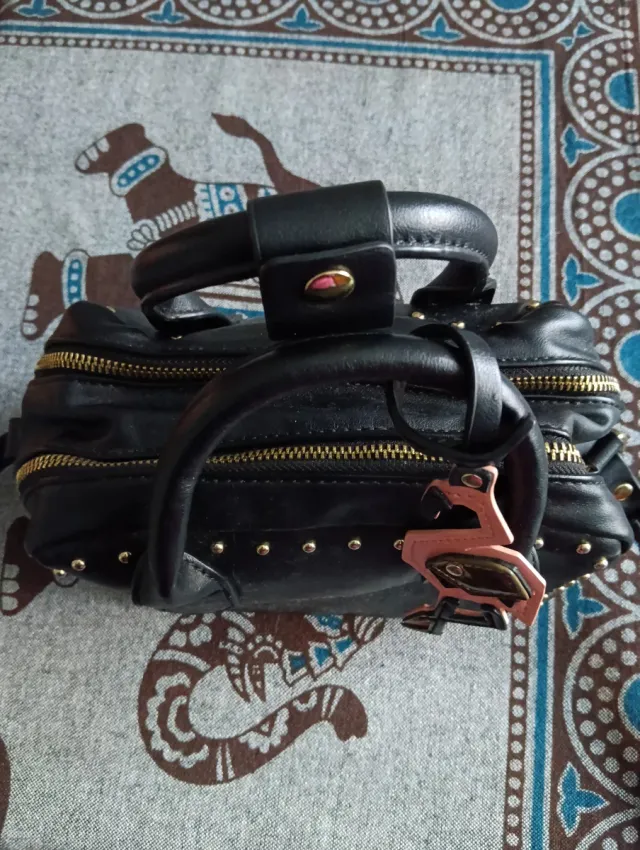 Bolso negro pequeño doble cremallera flamenco