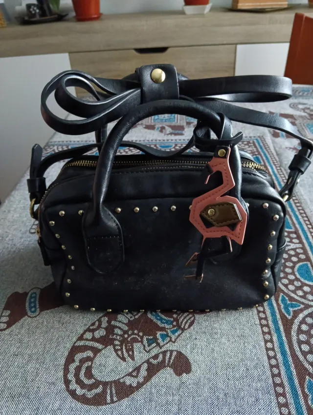 Bolso negro pequeño doble cremallera flamenco
