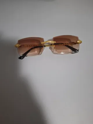 Gafas de sol Cartier doradas