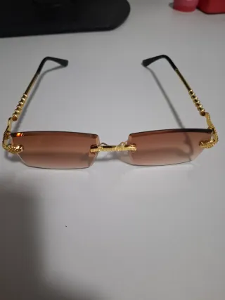 Gafas de sol Cartier doradas