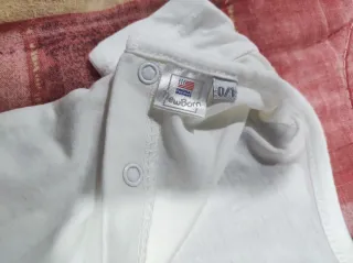 Pagliaccetto neonato stampa uccellino