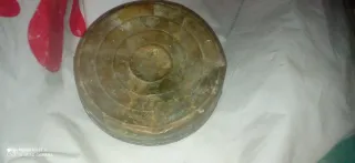 Oggetto in ottone o rame.antico forse per illumina