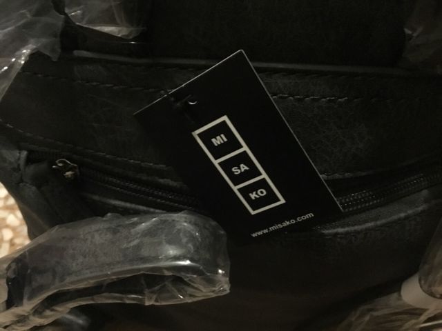 Mochila Misako gris con cierre botón