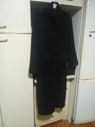 Chaqueta Giesswein y bolso cuero