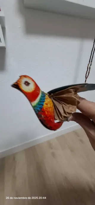 Juguete pájaro vintage de hojalata