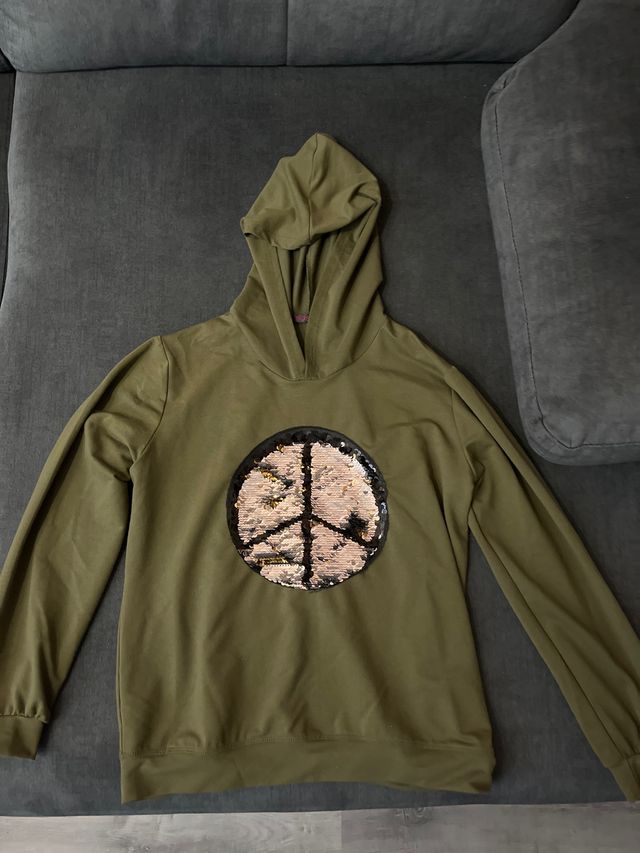 Sudadera verde con símbolo de la paz lentejuelas