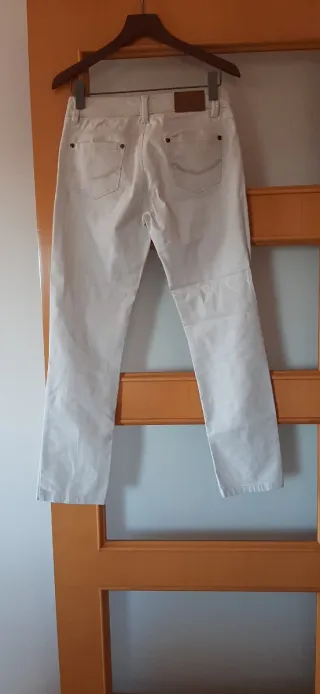 Pantalón vaquerobeige Bandolli. Perfecto estado