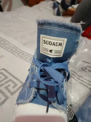 Botines vaqueros con detalles