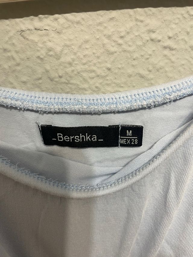 Body azul bebé con volantes