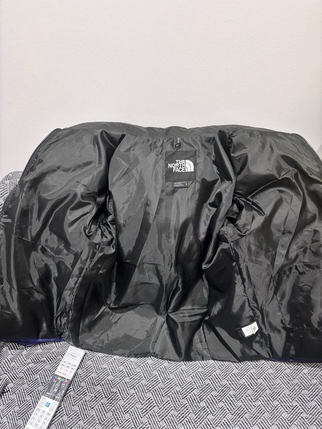 Cazadora The North Face azul y negra