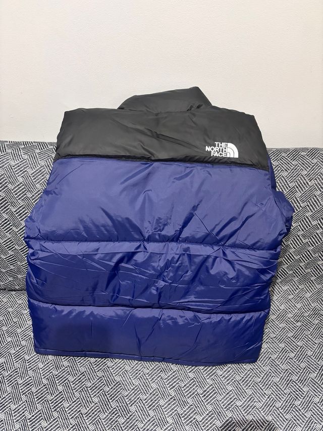 Cazadora The North Face azul y negra