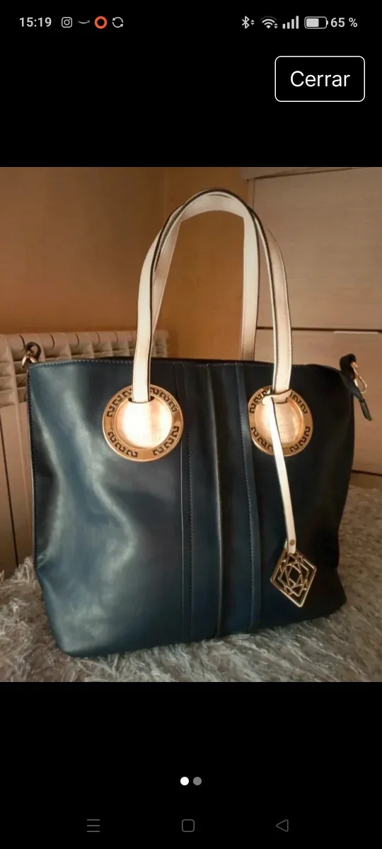 Bolso polipiel azul marino , y dorado.