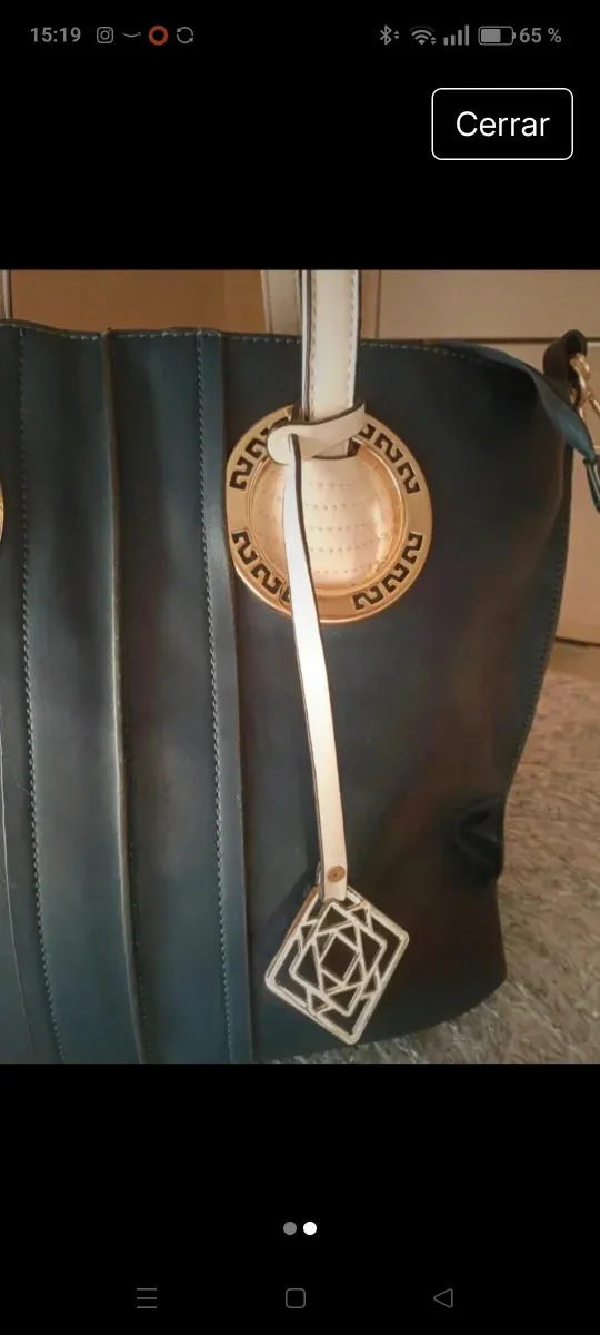 Bolso polipiel azul marino , y dorado.