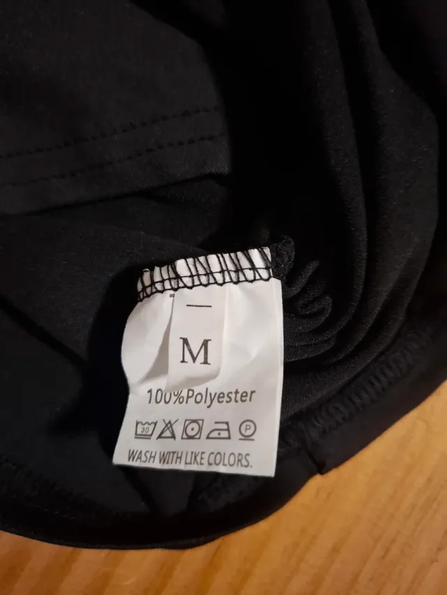 BLUSA hombros desciniertos negra