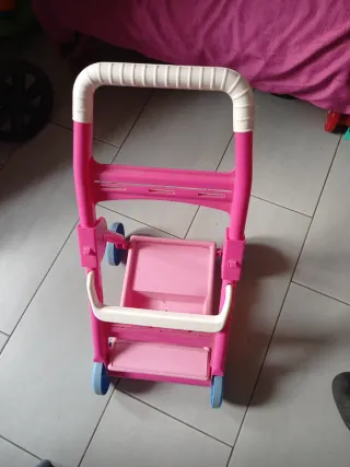 Passeggino giocattolo rosa per bambole e oggetti
