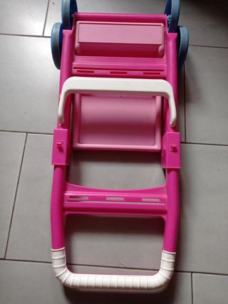 Passeggino giocattolo rosa per bambole e oggetti