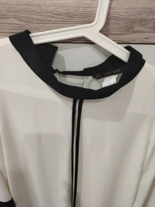 Blusa de mujer con ribete negro