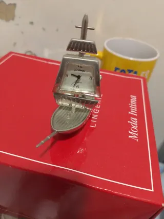 Mini reloj de barco plateado