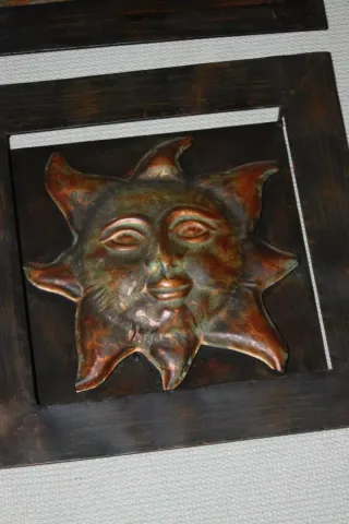 Quadri in metallo a forma di sole