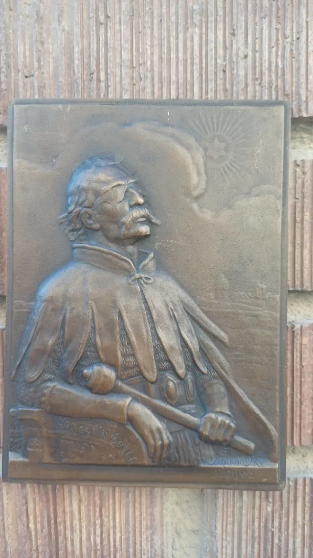 Placca di bronzo firmata