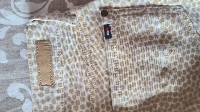 Pantalones estampados beige y marrón