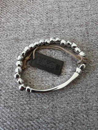 Pulsera Uno de 50 Goteando Plata