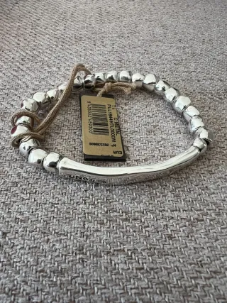 Pulsera Uno de 50 Goteando Plata