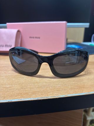 Occhiali Miu Miu neri e oro