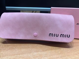 Occhiali Miu Miu neri e oro