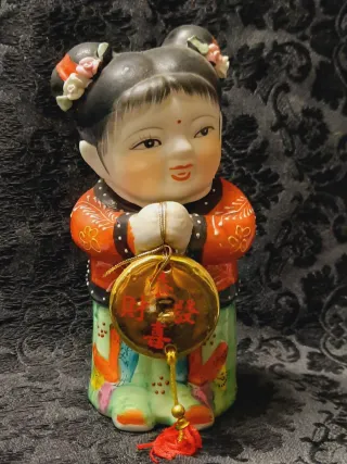 Coppia figure orientali con monete