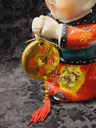 Coppia figure orientali con monete