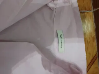 Blusa rosa pálido con botones nacarados