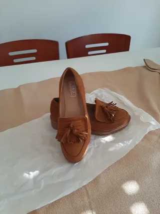 Zapatos mocasines marrones con flecos