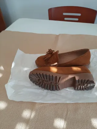 Zapatos mocasines marrones con flecos