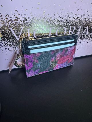 Cartera Victoria's Secret floral con llavero