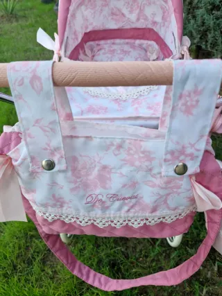 Carrito capazo rosa juguete con sombrilla